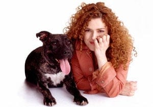 Bernadette Peters poses with her dog.