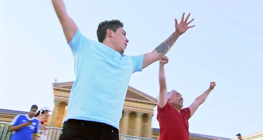 Cesar and his son Andre climb the famous Rocky steps in Philadelphia.