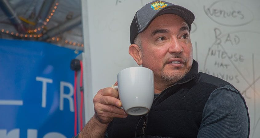 Cesar with a cup of coffee