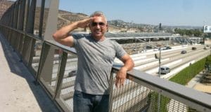 Cesar Millan poses for a picture.